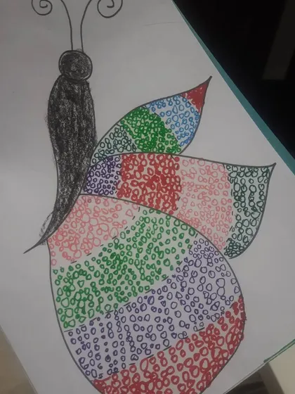 Another example of the colorful and intricate butterfly doodle art our students create.