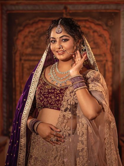 The full view of this gorgeous bridal lehenga. The detailed embroidery, the rich colours, and the way it flows make it a perfect choice for your special day. I can customise the colours and embroidery to match your vision.