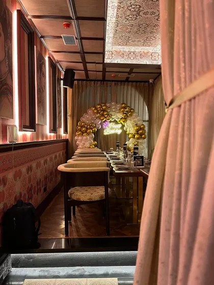 A look into the private dining room, with the balloon arch creating an inviting entrance.