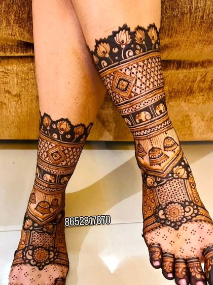 Another angle of the foot mehndi, showing the intricate details on the toes and the beautiful patterns covering the feet.