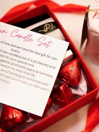 Romance in a box. Our Twin Candle Set for Valentine's Day includes two beautiful candles and heart-shaped chocolates to help you celebrate your love.
