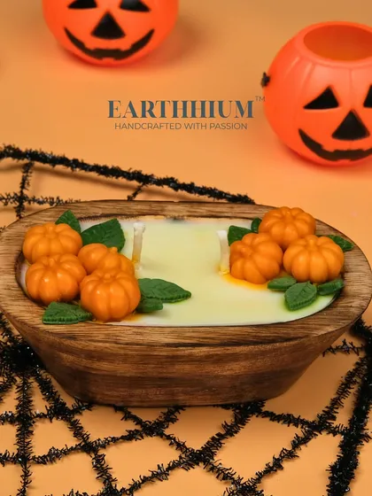 Another view of the pumpkin wooden bowl candle, ready to bring a cozy, spooky vibe.