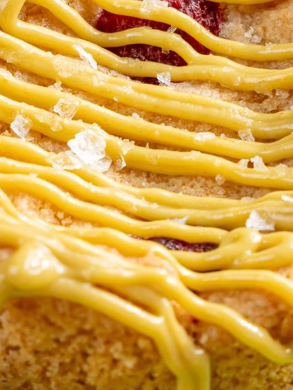 A macro shot of the pistachio crème and sea salt crystals on our Pistachio Raspberry Cookie. It's all about those beautiful textures and flavors.