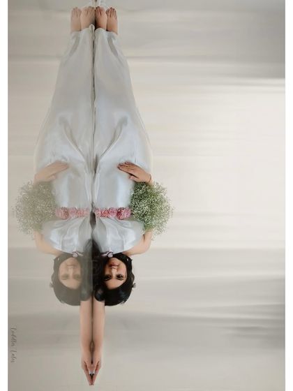 A story untold. This inverted reflection shot is a highly artistic and conceptual take on maternity, creating a visually arresting image that invites contemplation and wonder.