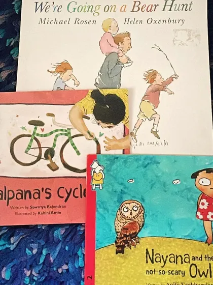 A collection of books for our 'Stories on Courage' session, including the classic 'We're Going on a Bear Hunt' and 'Kalpana's Cycle'.