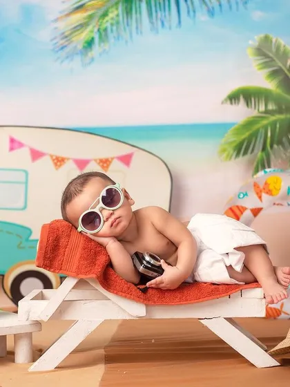 A duplicate of 112, capturing the relaxed vibe of a baby napping at the beach.