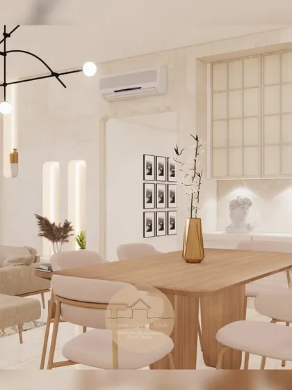 This bright and airy dining space is designed for calm and connection. The light wood table and chairs, paired with modern overhead lighting and fluted glass cabinetry, create a sophisticated yet welcoming atmosphere.