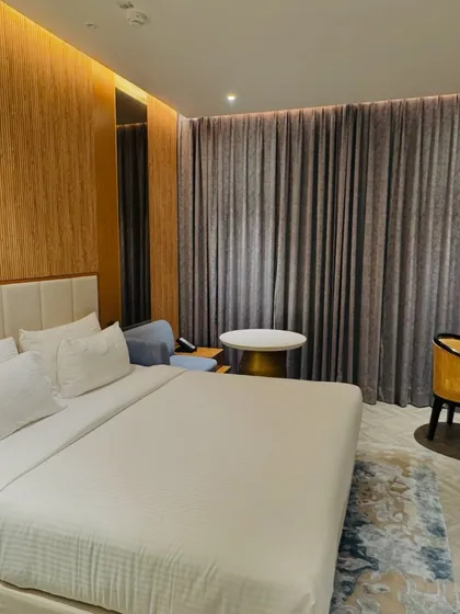 A look at a standard king-size hotel room we can book for your wedding guests. We check for cleanliness, space, and amenities to ensure a comfortable stay.
