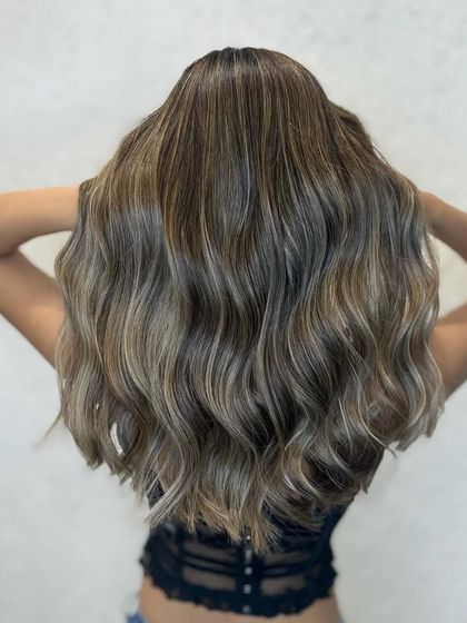 That golden glow. This is a gorgeous golden balayage that looks natural and radiant, finished with my signature waves.