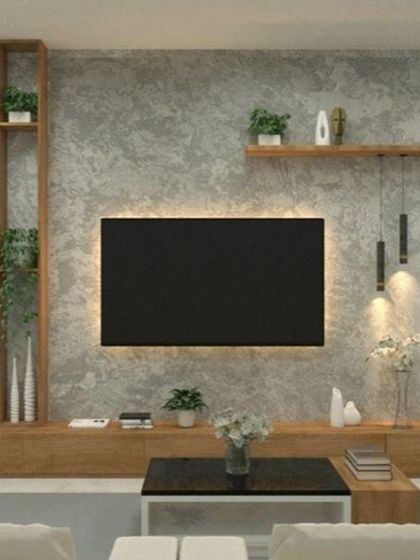 A nature-inspired TV unit design that embodies our biophilic approach. The unit combines a concrete-finish wall with extensive open wood shelving, providing ample space for decorative plants and creating a living, breathing entertainment center.