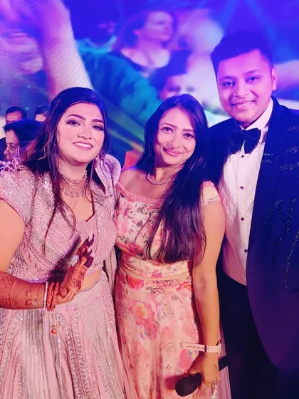 The best part of my job is the relationships I build. It was an honor when a client, whose Sangeet I hosted a decade ago, tracked me down to host his own. This photo with the happy couple, Ansh and Dinky, is a testament to the lasting connections I forge.