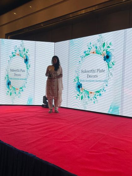 This is me on stage at the Kovai Business Awards 2022, a moment of immense pride. This award for Best Wedding Craft is dedicated to everyone who has believed in my work.