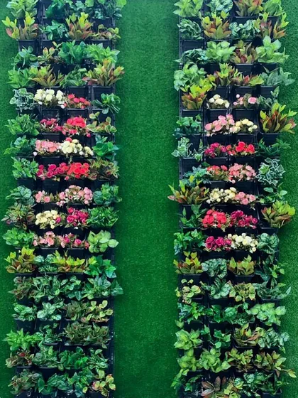 A close-up of the artificial flower panels used on a terrace wall. The combination of green leaves and colorful blossoms provides a cheerful, garden-like feel without any of the work.