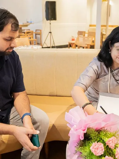 A close-up of the book signing process, a personal and meaningful interaction between the creator and the reader.