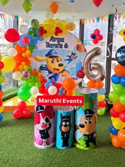A colorful and fun party based on the popular "Dogtanian and the Three Muskehounds" cartoon. The decor includes a custom backdrop, themed plinths, and bright balloon columns.