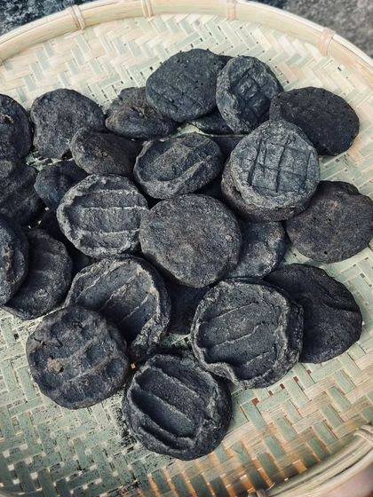 These are Anishi patties, a delicacy of the Ao Naga tribe. Made from sun-dried or smoked Colocasia leaves, they form the base of a unique and earthy black curry.
