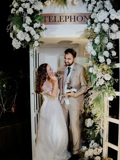 The couple enjoying their unique audio guestbook, a fun and interactive element for their wedding day.
