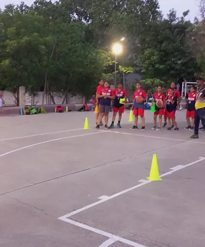 Coach Rohit demonstrating a dribbling technique during the coaching camp in Aurangabad.
