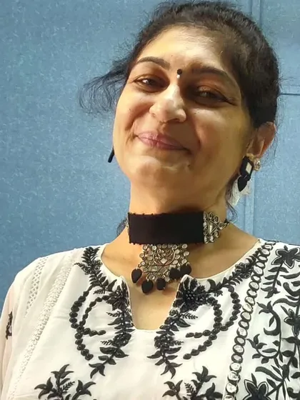 A happy client wearing my black fabric and oxidized silver choker set. It looks wonderful with her black and white embroidered top.