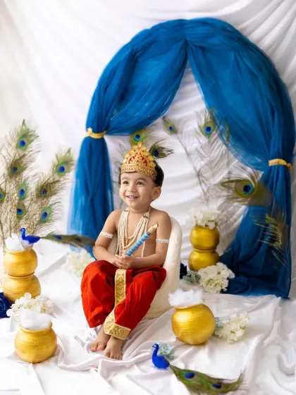 Look at this adorable little Kanha. I have so much fun creating special themed photoshoots for festivals like Janmashtami, complete with costumes and a vibrant setup.