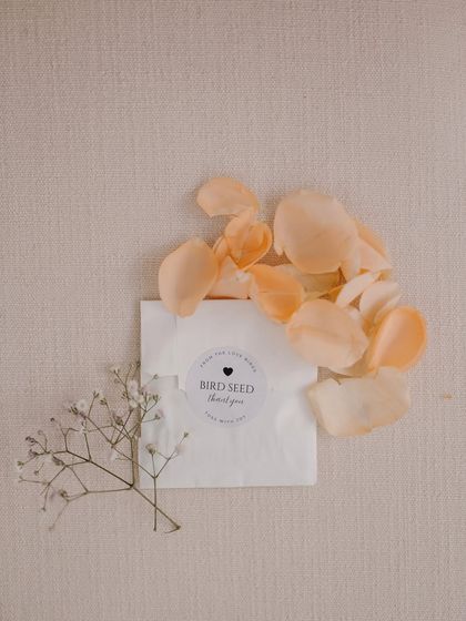 A thoughtful and eco-friendly guest favor: packets of birdseed for guests to shower the couple with, so the birds could join the celebration too.