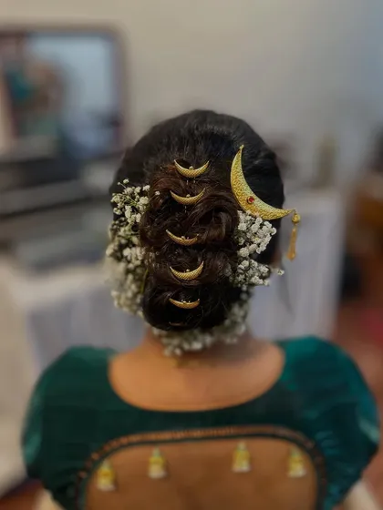 A clear view of the neat and intricate 'khopa' hairstyle, a specialty that I love creating.