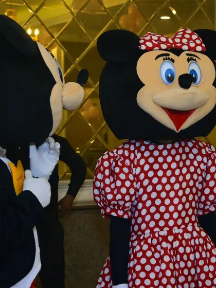 A close-up of the Minnie Mouse mascot interacting with guests. It's these little extras that create lasting memories for you and your family.