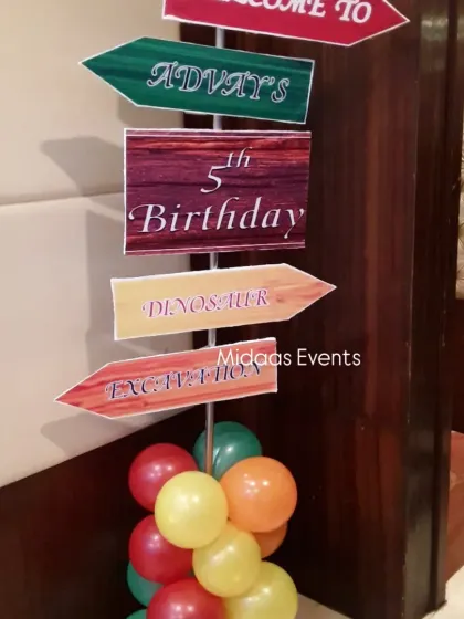 It's all in the details. A custom-made directional sign for Advay's 5th birthday, pointing guests to the 'Dinosaur Excavation' and adding a fun, interactive element to the party decor.