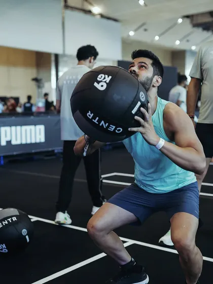 A 9kg wall ball squat during a Hyrox competition. Functional strength is a cornerstone of my training philosophy, and it's something I emphasize in the plans I create for athletes.