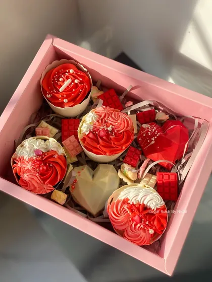 My 'Love Treat Box' is perfect for Valentine's Day or anniversaries. It's filled with red and white themed cupcakes and heart-shaped chocolates.