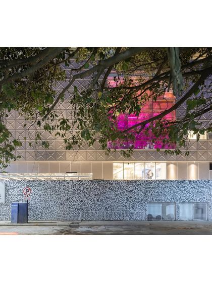 An image from the Dezeen article, showing the MAP facade at night.