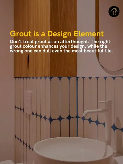 Grout is a critical design element, not an afterthought. The right grout color can enhance your tile design, like this blue grout that creates a stunning graphic pattern with white vertical tiles.