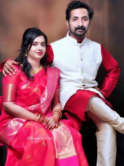 A couple dressed for an anniversary celebration. I gave the client a soft, romantic makeup look with loose curls to complement her beautiful pink saree.