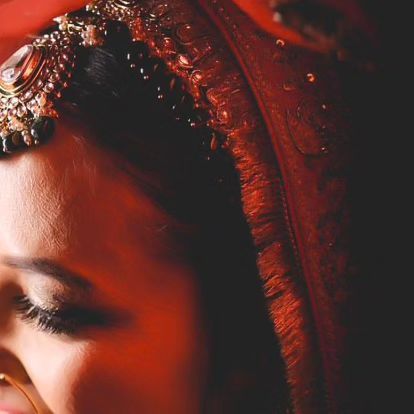 A close-up, artistic shot of a bride's eye makeup, showing the delicate details of her look.