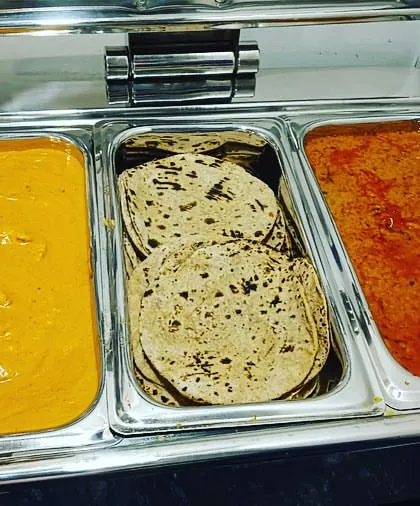 A look inside my premium chafing dishes, showcasing a variety of main courses. This one features a creamy Shahi Paneer, classic rotis, and a rich dal.