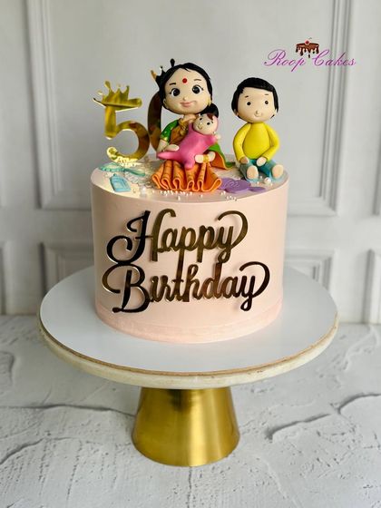 A special cake for a grandma's 50th birthday, topped with a beautiful figurine of her with her grandchildren.