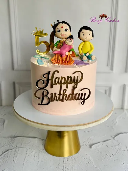 A special cake for a grandma's 50th birthday, topped with a beautiful figurine of her with her grandchildren.