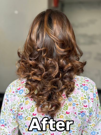 The final result of the ombre hair color, styled into beautiful, bouncy curls.