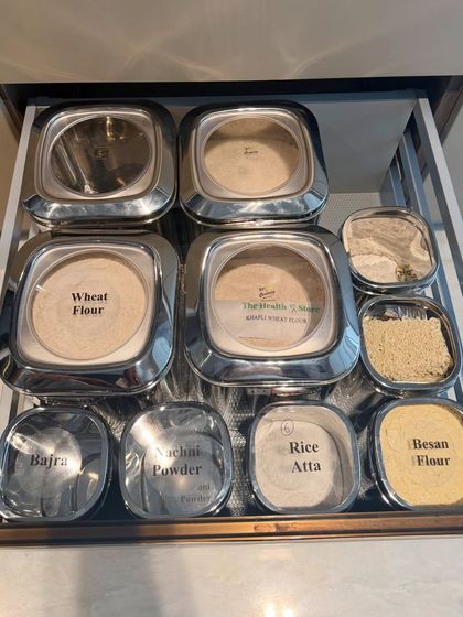 A drawer dedicated to various types of Indian flours, from wheat and bajra to besan and rice atta. Decanting them into labeled, airtight containers keeps them fresh and makes them easy to identify.
