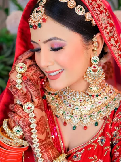 A candid moment captured during a bridal shoot, showing a natural smile and the elegance of the wedding attire.