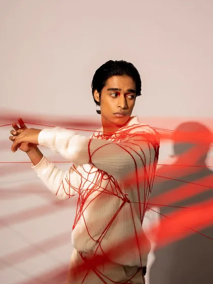 A conceptual men's grooming look for a fashion photoshoot. I kept the makeup minimal and the hair sleek to work with the creative concept involving red thread.