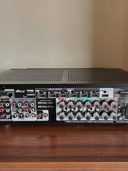 A look at the back panel of a Marantz Cinema 70s AV receiver. With support for Dolby Atmos and DTS:X, this is the brain that powers a high-performance home theater, and I make sure every connection is perfectly configured for optimal sound.