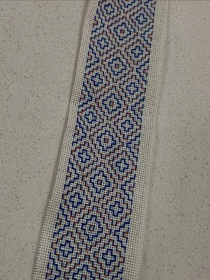 A close-up of a Kasuti sampler. The precision of the counted-thread work is something I teach in detail in my classes.
