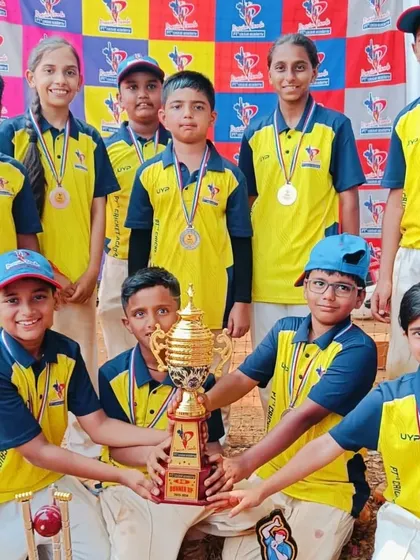 A proud moment for the U-10 runners-up, posing with their trophy and medals. This experience builds resilience and a love for competitive cricket from a young age.