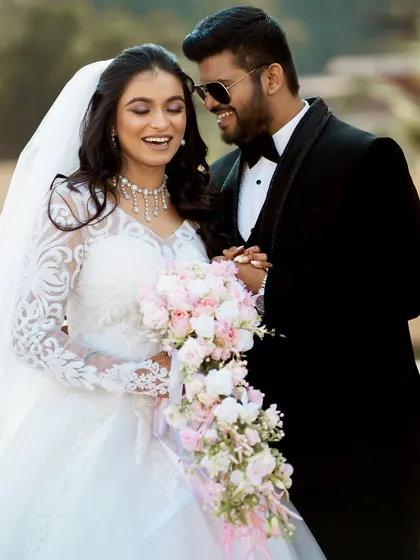 A candid moment of laughter and joy between the newlyweds.