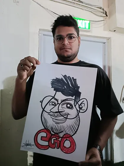 A guest with his caricature labeled 'Ego'. It's all in good fun.