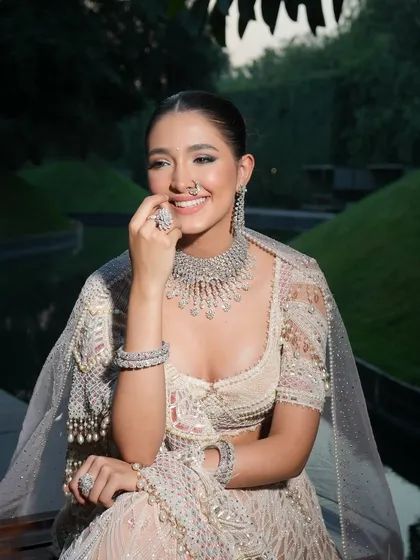 The happiness of a bride is the best accessory. This candid shot shows how a perfectly styled outfit can make a bride feel comfortable and radiant.