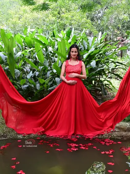 Celebrate your journey to motherhood with a memorable photoshoot. This beautiful red flying gown is designed to be comfortable and stylish, making you feel like a goddess while we capture these precious moments.