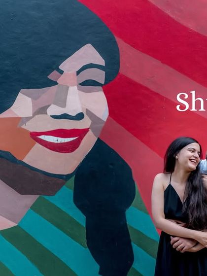 A duplicate of image 96, this shot perfectly captures the fun and modern vibe of a pre-wedding shoot using street art as a backdrop.