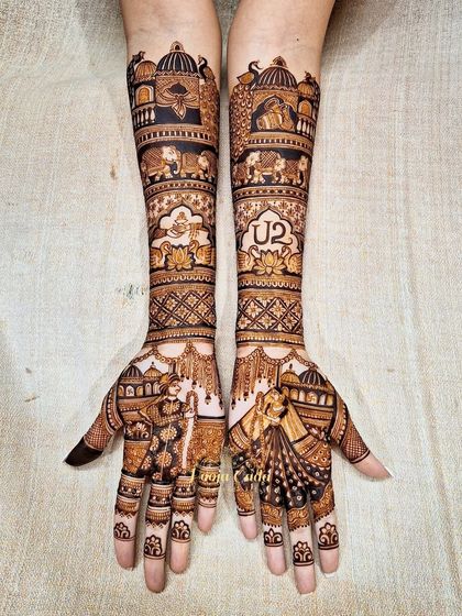 The same U2-themed bridal design, showcasing the beautiful bride and groom figures on the palms, proving that personal passions can be part of your traditional mehendi.